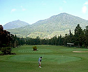 playing golf surrounded by mountains