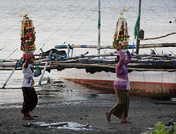 Balinese women bring the offerings to the temple Balinese women bring the offerings to the temple